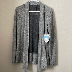Brand new KUHL womens nova wrap in ash. Never worn